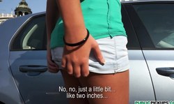 Brunette Lizzy Monroe shows off her enhanced tits in public place