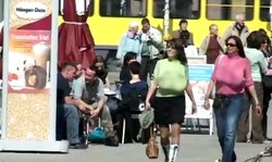 Two impressive MILFs with giant tits are walking on the street