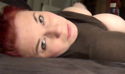 Amateur redhead chick shows off her naked boobies in a hot angle