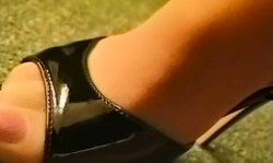 Cute Nylon Fetish chick on glossy high heels undresses in the bed