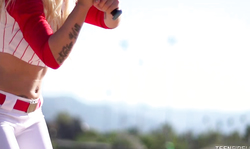 Ultra slender sporty blonde is posing in a baseball outfit