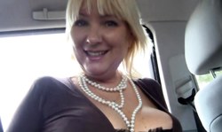 Adorable smiling MILF shows off her gorgeous naked boob