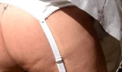 Stunning big-boobed brunette reveals her naked bottom outdoors