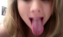 Cute amateur mademoiselle with big boobs shows her very long tongue