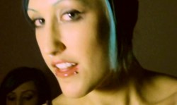 Gorgeous punk girls are kissing and showing their tongues