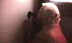 Seduced amateur blonde sucks a loaded black dick in the gloryhole