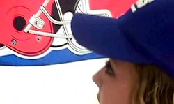 Amateur teen in blue cap gives a blowjob with a smile on her face