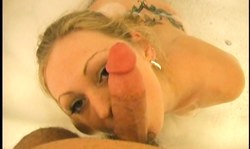 Teen with innocent eyes sucks a soapy dick in the bathtub