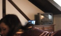 Good-looking amateur Lapdancer is lying on the bed in striped dress