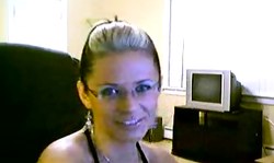 First-class cam girl plays with her red dildo on web cam