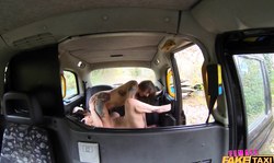 Two fully naked sex dolls are fucking on the black hood