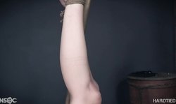 Hard Tied bitch is hanging in the air during BDSM torturing