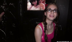 Sweet nerdy slut sucking cocks in Glory Hole Loads video
