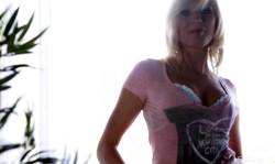 Short-haired blonde treating her little pussy in bedroom