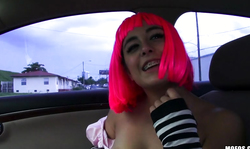 Beauty in pink wig having intensive sex in the car