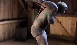 Chubby tattooed MILF with massive tits in the BDSM dungeon