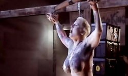 Short-haired blonde MILF with huge tits loves BDSM games