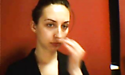 Brunette is applying makeup and then slowly undressing