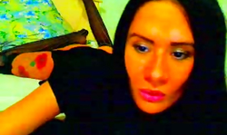 Impressive black-haired girl is blowing her lovely dildo