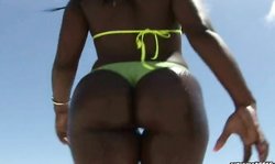 Stunning big-bottomed model Mina poses on the beach in yellow bikinis