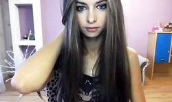 Cutest young beauty is slowly posing and playing with her tongue