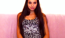 Long-haired brunette is revealing her vagina and playing with her ass