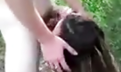 Kinky long-haired babe performs a good blowjob in the woods