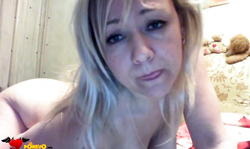 Playful busty russian milf poses fully naked on the camera in the bedroom