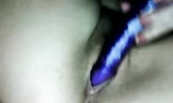 Topless Russian babe sticks a big toy deep in her wet crack