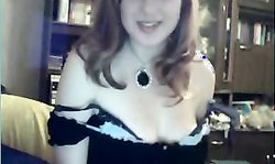 Smiling amateur Russian chick is getting topless on webcam