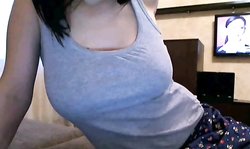 Great-looking busty Russian doll poses hot on the webcam