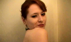 Smiling redhead wife is taking a hot shower on the camera