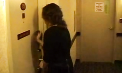 Black-haired woman is revealing her sexy shape in the bed