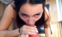 Cute young brunette is sucking his hard dick like a pro