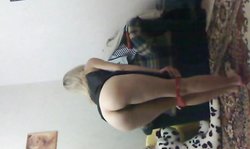 Beautiful Russian blonde with nice ass is slowly getting naked