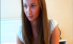 Long-haired teenager is showing off her wide-opened pussy