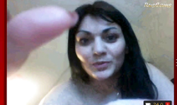 Black-haired girlfriend in black fishnet rubs her little pussy