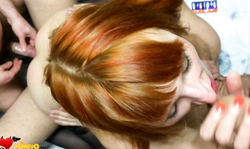 Slutty redhead chick is getting pounded by two hard poles