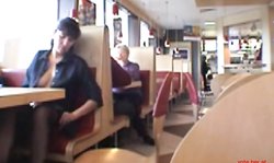 Busty babe flashing in a restaurant