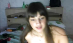 Dark-haired Russian chick is playing with her naked pussy