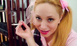 Blonde is smoking in the close-up and enjoying fetish