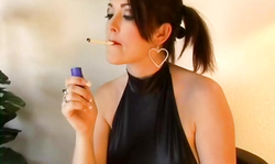 Elegant milf sucks a dildo and smokes a cigarette in the vid by Alta Smoking