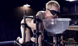 Strapped blonde pussy toyed in device