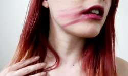 Stunning redhead hottie shows off her beautiful red lips