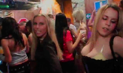 Sensual drunk ladies are dancing on stage without shame