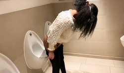 London Sweetie uses Urinal in Mens Lavatory