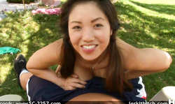 Sexy Asian beauty is giving a handjob at the backyard