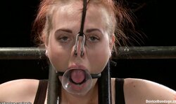 Ginger dyke spanked on device bondage