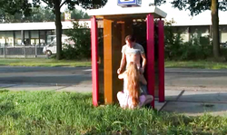 Slender redhead slut is sucking a hard wiener on public