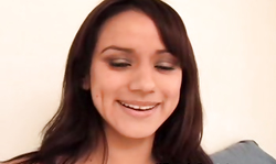 Smiling milf in pink lingerie Nadia Styles is soloing in the bedroom